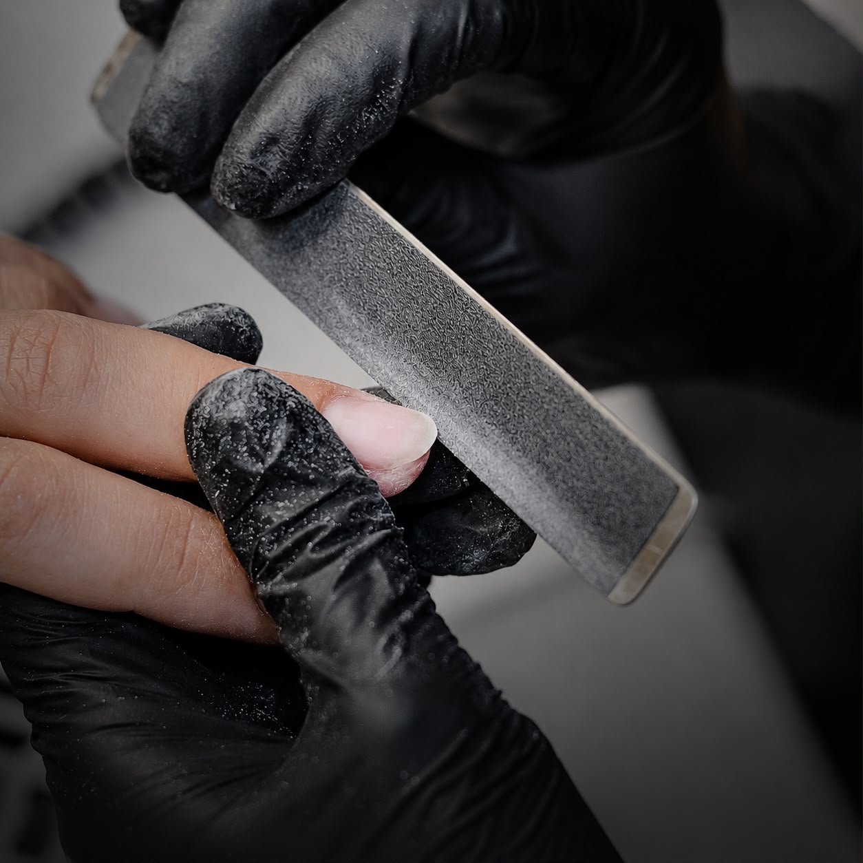 Close-up of a manicure in progress